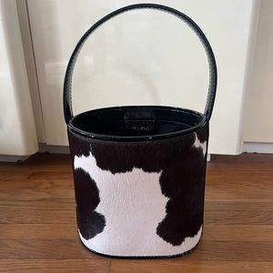 Stand cow print bucket bag
